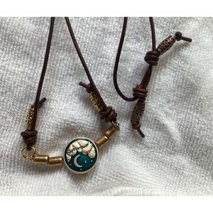 Handmade metal button neckless. 24 inch adjustable 2mm leather cord